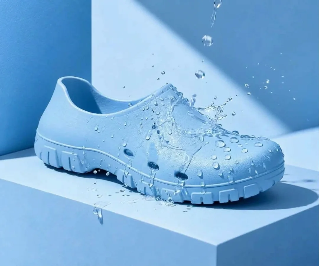 Water beading off the closed upper of a light blue POSSO clog